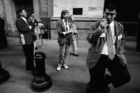 Traders take a break outside The New York Stock Exchange on February 16, 1988