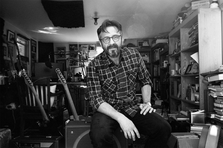 Marc Maron photographed in 2015 in his garage where he recorded “WTF.” As his podcast comes to an end, we look back at his best episodes.